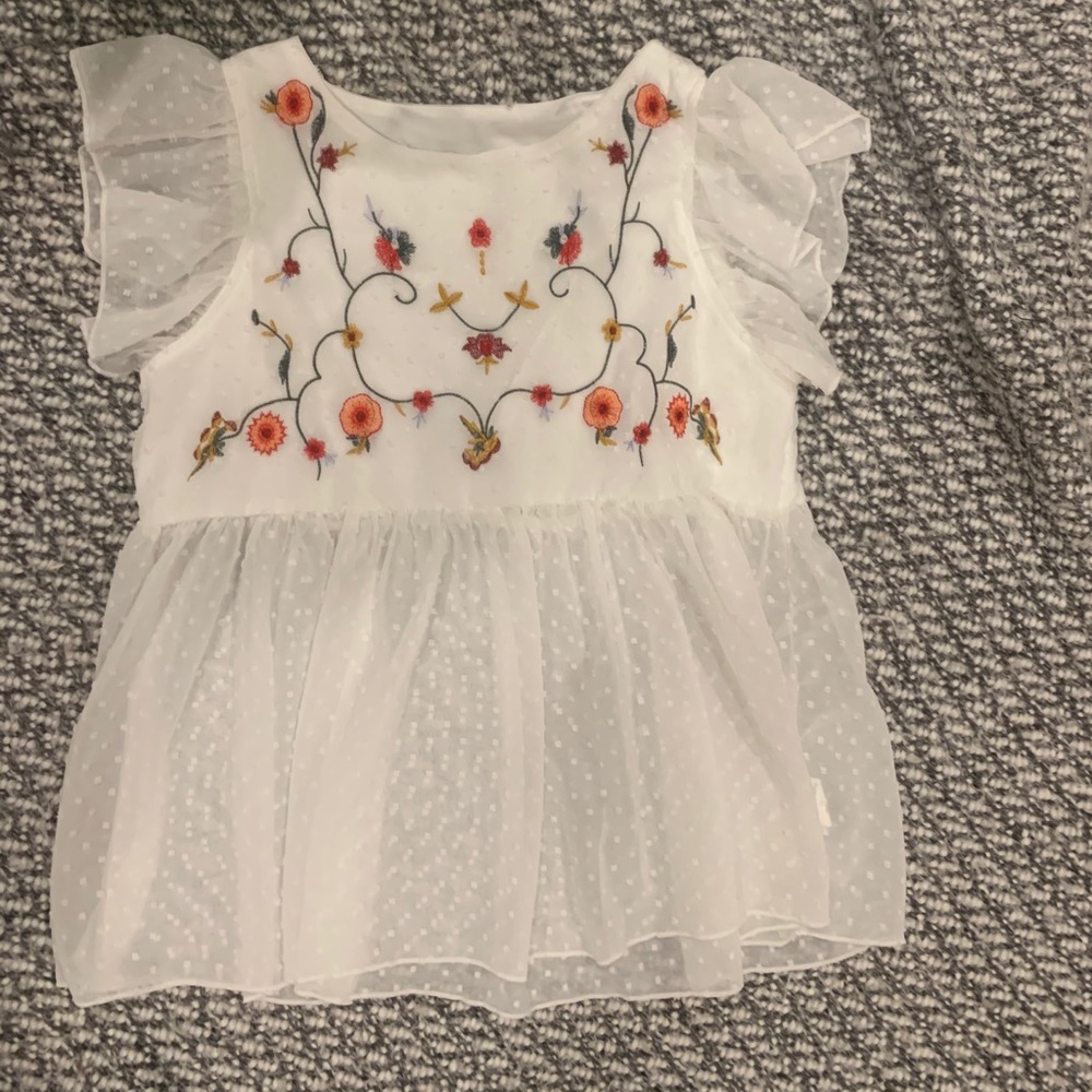 White babydoll top with floral embroidery